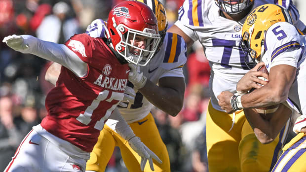 Razorbacks Hudson Clark tries to shed an LSU blocker last November